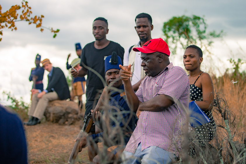 Directing a scene on location with cast and crew in Malawi